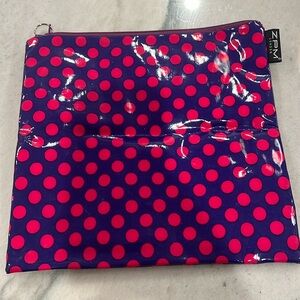 Wipeable makeup/toiletries bag. Brand new. Approx 9 1/2” square. Fun dots design